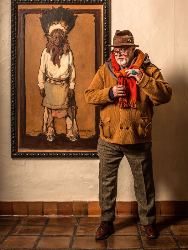 A Person Standing Next To A Painting