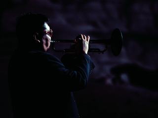A Man Playing A Trumpet