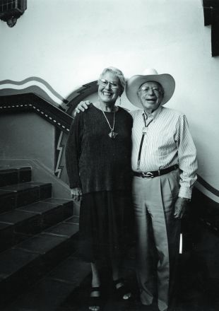 A Man And A Woman Posing For A Photo